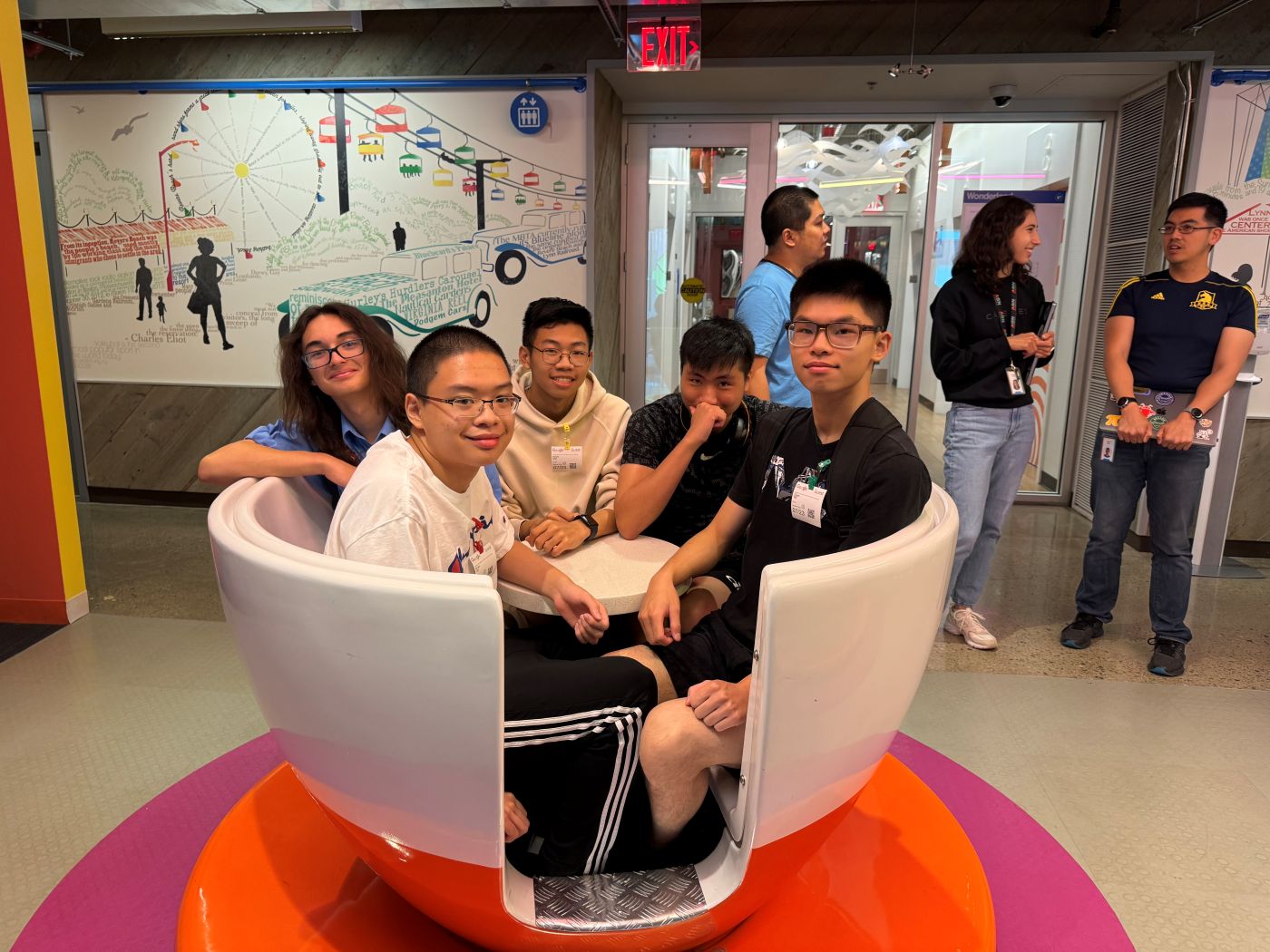teens sitting around round table