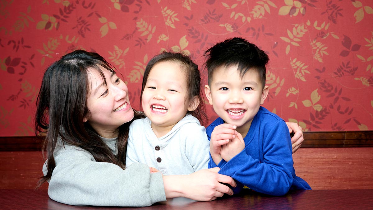 mom holding two sons
