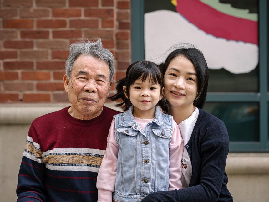 Family portrait of grandfather, little girl, and mom